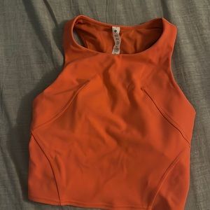 Lululemon top. Size 2. Looks orange but it red